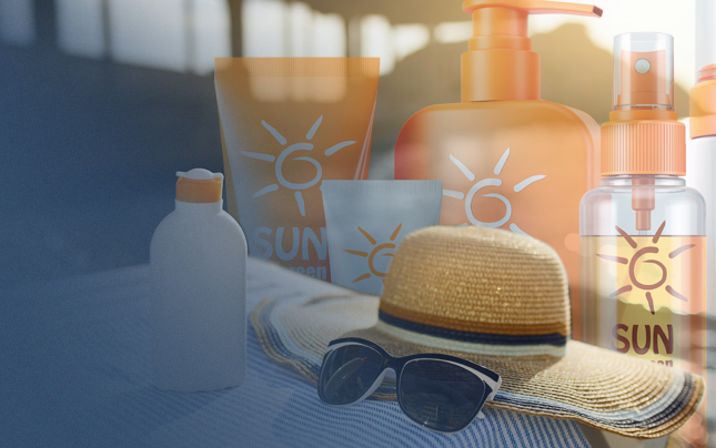 Image of sunscreen products, hat, and sunglasses