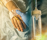 patient's hand receiving treatment for cancer
