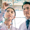 Scientists viewing chemical structure diagrams