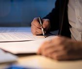 Person signing document contract