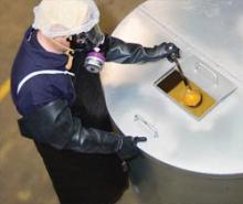 Worker in safety gear handling diacetyl