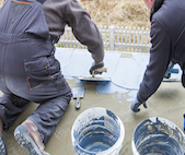 workers using cement sealants